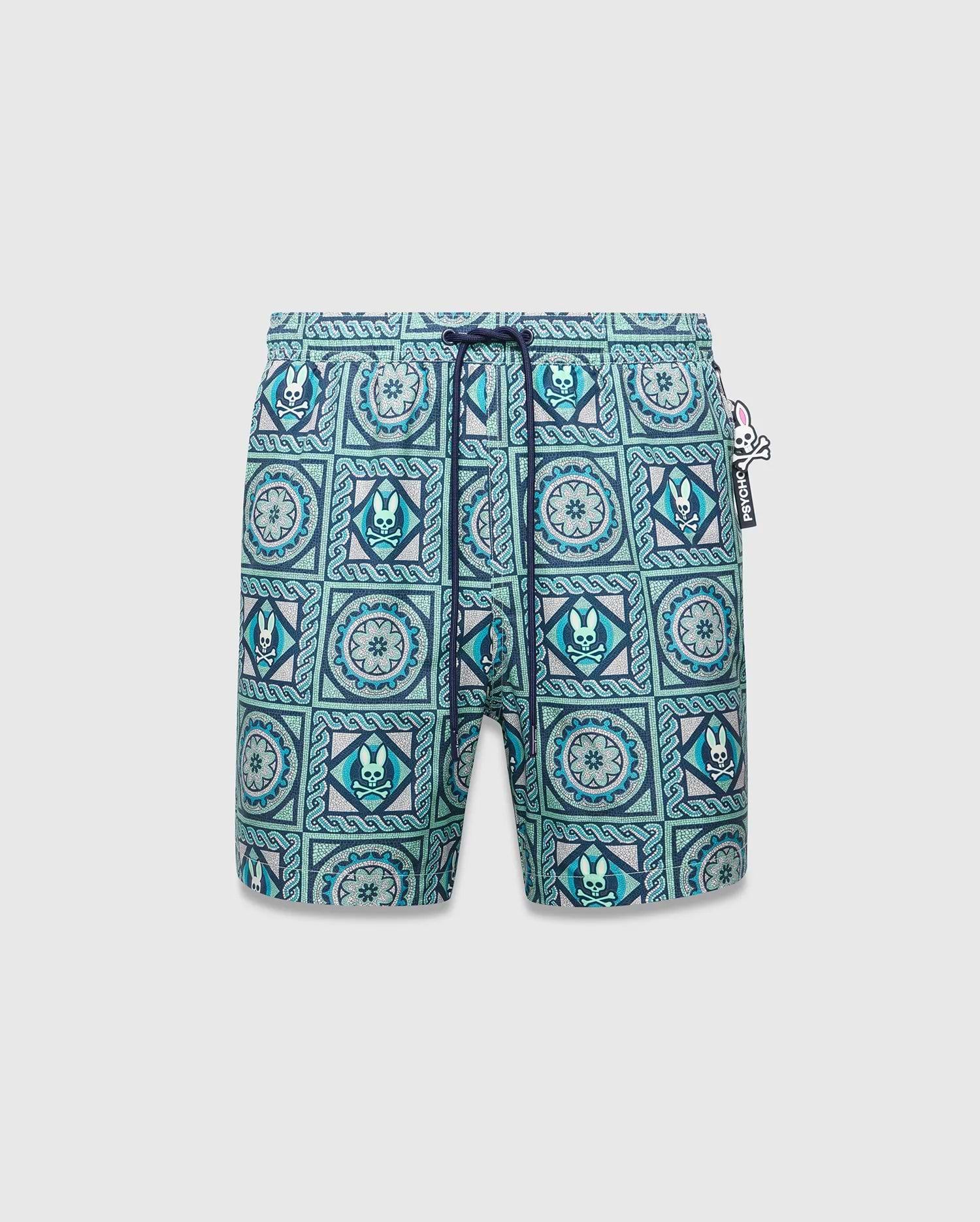 Mens Frank Swim Trunk 6, classic fit, vibrant teal, blue, and white mosaic tile pattern with repeated Psycho Bunny skull logos, floral motifs, dark blue drawstring, and a Psycho Bunny hip tag. (5)