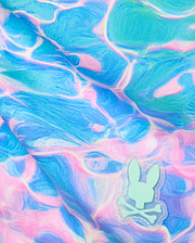 Mens Dayton Swim Trunk 6 featuring a vibrant blue and pink water ripple pattern on smooth fabric, accented by a small mint green rubberized Psycho Bunny skull logo patch. (6)
