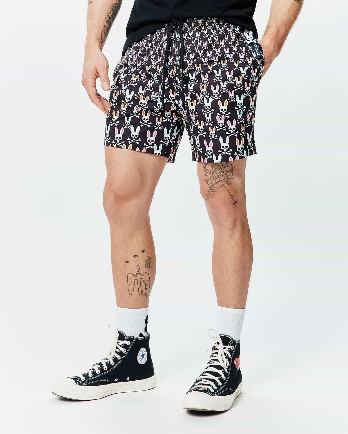 Mens Byron Swim Trunk 6, black with a vibrant all-over multicolored Psycho Bunny skull and crossbones print, classic fit, smooth fabric, and a small logo tag on the pocket. (1)