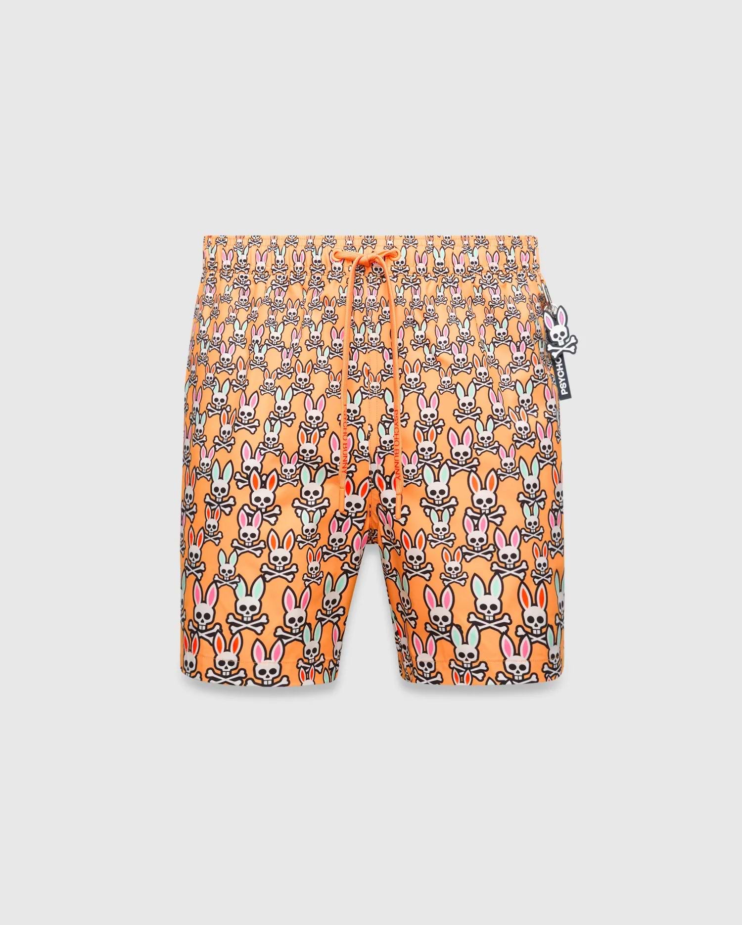 Mens Byron Swim Trunk 6, orange with an all-over multi-color Psycho Bunny skull pattern, drawstring waist, and a small Psycho Bunny logo charm.