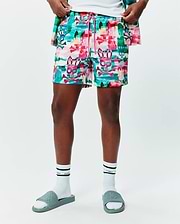 Mens Nate All Over Print Swim Trunk in a vibrant multi-color abstract brushstroke pattern featuring repeated Psycho Bunny skull and crossbones logos, with a pink drawstring, offering a relaxed fit.