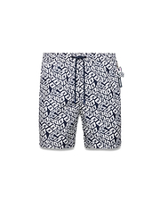 Mens Eddy All Over Print Swim Trunk in navy blue and white, featuring an all-over 3D cube pattern with small Psycho Bunny skull logos, classic fit, drawstring waist, and smooth quick-dry fabric.