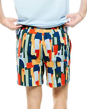 Mens Wes All Over Print Swim Trunk featuring a vibrant multi-color abstract pattern with repeated small Psycho Bunny skull logos, a relaxed fit, and a back flap pocket.