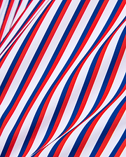 Mens John All Over Print Swim Trunk featuring a vibrant diagonal stripe pattern in white, bold red, and deep blue, on a smooth, flowing fabric.