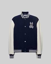 Mens Jacob Leather Bomber in navy with cream leather sleeves, featuring a large embroidered Psycho Bunny skull logo on the left chest, snap buttons, and white striped ribbed knit trim.