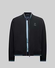 Mens Aldrin Bomber jacket in black, featuring a classic fit, smooth fabric, light blue and white striped ribbed collar, cuffs, and hem, with a small embroidered light blue Psycho Bunny skull logo on the left chest.