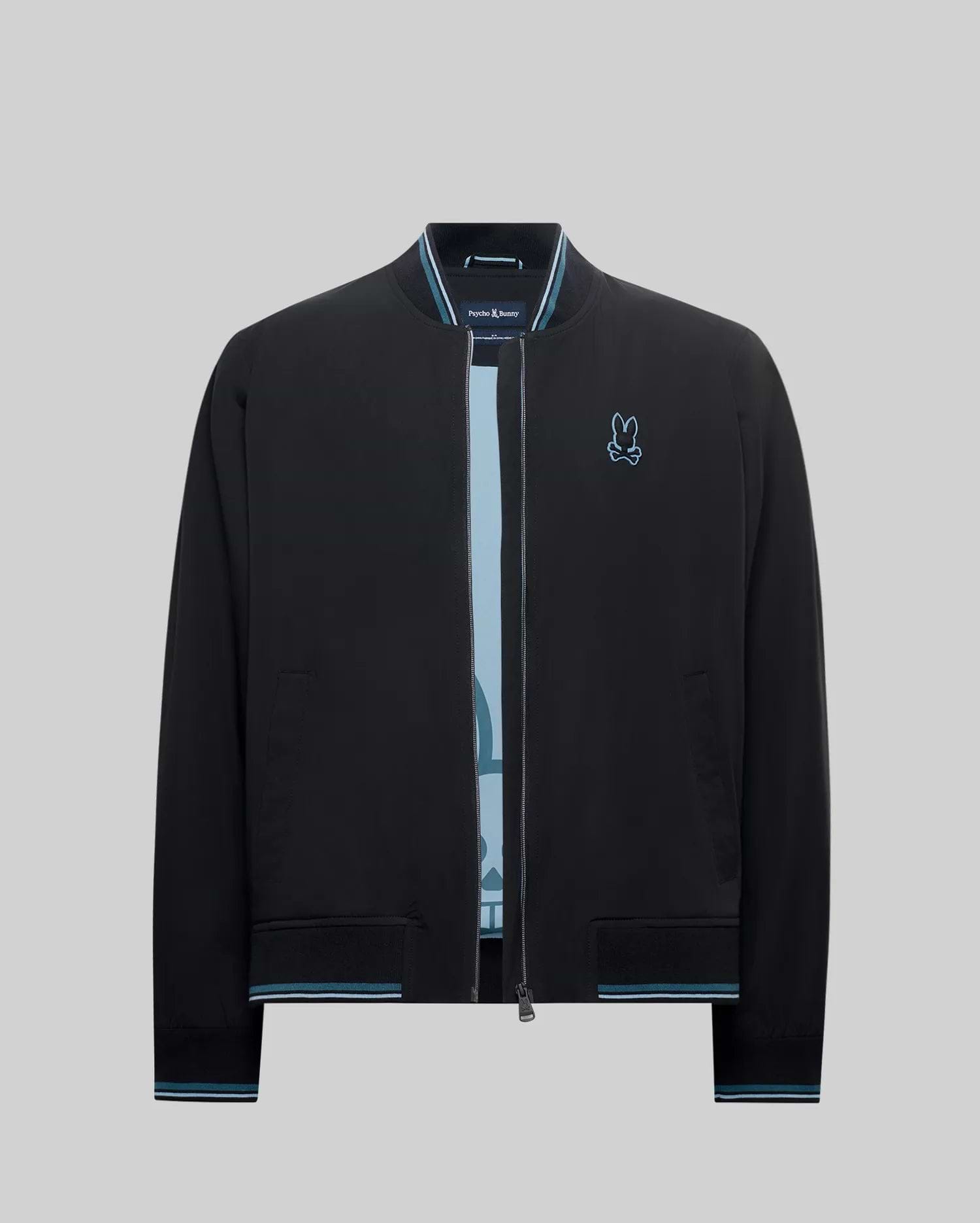 Mens Aldrin Bomber jacket in black, featuring a classic fit, smooth fabric, light blue and white striped ribbed collar, cuffs, and hem, with a small embroidered light blue Psycho Bunny skull logo on the left chest.