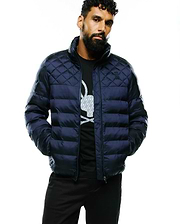 Mens Emerik Hooded Puffer Jacket in dark navy, featuring a quilted upper with horizontal baffling, a classic fit, smooth puffer fabric, and a tonal embroidered Psycho Bunny skull logo on the left chest.