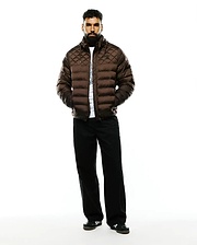 Mens Emerik Hooded Puffer Jacket in rich brown, featuring a diamond-quilted upper, horizontal baffles, a classic fit, and a subtle black Psycho Bunny skull logo on the left chest.