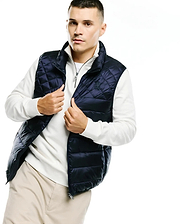 Mens Emerik Quilted Puffer Vest in navy blue, featuring diamond quilting, a full zip closure with a branded pull, and a small embroidered Psycho Bunny skull logo on the left chest.