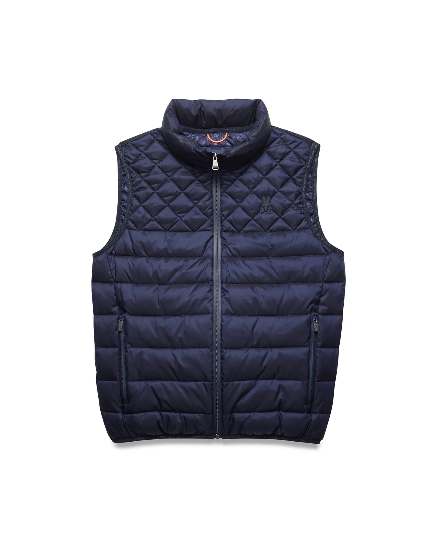 Mens Emerik Puffer Vest in navy, featuring a quilted upper with an embroidered Psycho Bunny skull logo, horizontal baffles on the lower body, full zip, and zippered pockets. Orange accent inside collar.