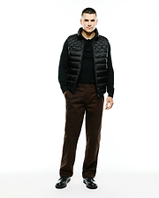 Mens Emerik Quilted Puffer Vest in black, featuring a classic fit, diamond quilting, full zip closure, stand collar, and a small embroidered Psycho Bunny skull logo on the left chest.