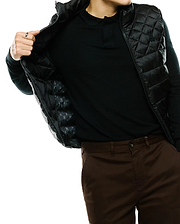 Mens Emerik Quilted Puffer Vest, black with a diamond quilted pattern, full zip, and small embroidered Psycho Bunny skull logo on the chest. Inner lining features a repeating skull logo pattern.