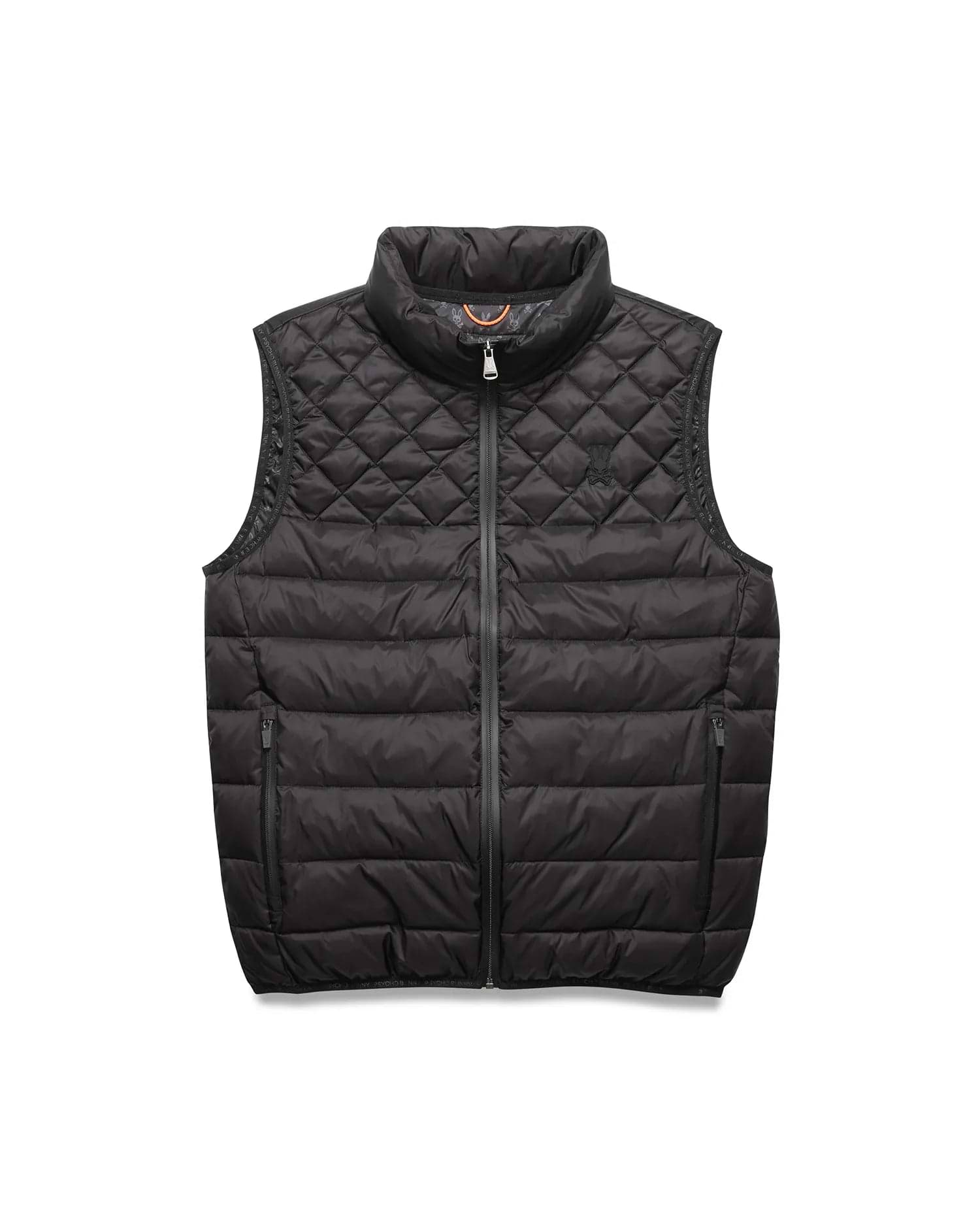 Black Mens Emerik Puffer Vest with quilted upper, horizontal baffles, small embroidered Psycho Bunny skull logo on left chest, full zip, and orange inner collar featuring repeating branding.