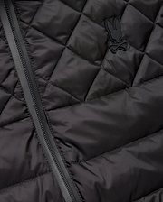 Mens Emerik Puffer Vest in black, featuring a quilted smooth nylon fabric, full-zip closure, and a small, tonal rubberized Psycho Bunny skull logo on the left chest.