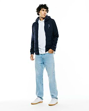 Mens Gordley Mix Media Jacket: Navy blue hooded full-zip jacket featuring a quilted puffer body, smooth sleeves, and a small white embroidered Psycho Bunny skull logo on the left chest. (3)