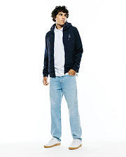 Mens Gordley Mix Media Jacket: Navy blue hooded full-zip jacket featuring a quilted puffer body, smooth sleeves, and a small white embroidered Psycho Bunny skull logo on the left chest. (3)