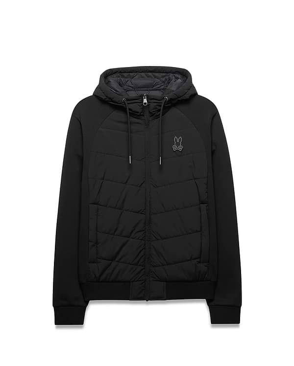 Mens Gordley Mix Media Jacket. Black hooded full-zip jacket featuring a quilted front panel, smooth raglan sleeves, ribbed cuffs and hem, with a small embroidered Psycho Bunny skull logo on the left chest. (5)