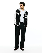 Mens Reilly Knit Coach Jacket: Black and white varsity style jacket with a layered grey hood, featuring a large 05 patch, embroidered Psycho Bunny skull, and New York script. (4)