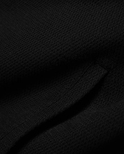 Mens Reilly Knit Coach Jacket in rich black, crafted from a premium, subtly textured knit fabric, embodying Psycho Bunny's refined streetwear style. (6)
