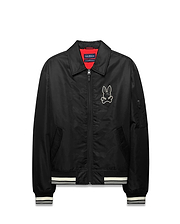 Mens Nathaniel Satin Coach Jacket, black with red lining, featuring a large white embroidered Psycho Bunny skull logo on the chest, white striped ribbed cuffs and hem, and a zippered sleeve pocket. (5)