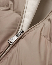 Men's Franco Reversible Bomber, a beige padded jacket with a cream knit lining and a full-zip closure featuring a silver Psycho Bunny skull logo engraved zipper pull. (6)