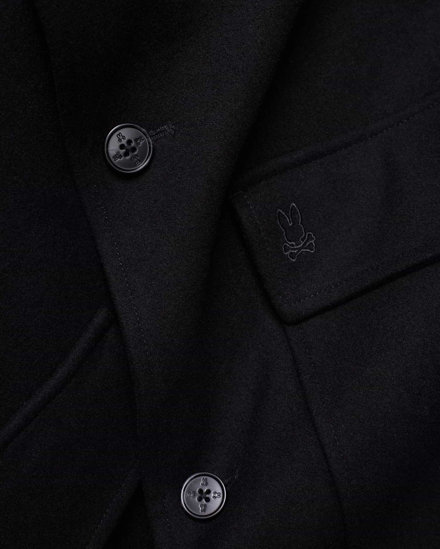 Mens Luther Wool Blend Coat, black, crafted from a smooth wool blend, featuring a tonal embroidered Psycho Bunny skull logo on the chest pocket flap and custom logo buttons.