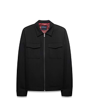 Men's Wayde Twill Overshirt, a black full-zip jacket with a classic fit, two chest flap pockets, a red patterned lining, and a small Psycho Bunny skull logo on the zipper pull. (5)