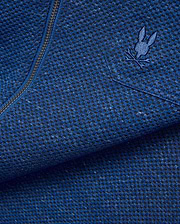 Mens Marc Textured Overshirt in deep blue heathered knit fabric with black flecks, featuring a dark metallic zipper and a small embroidered blue Psycho Bunny skull logo on the chest. (7)