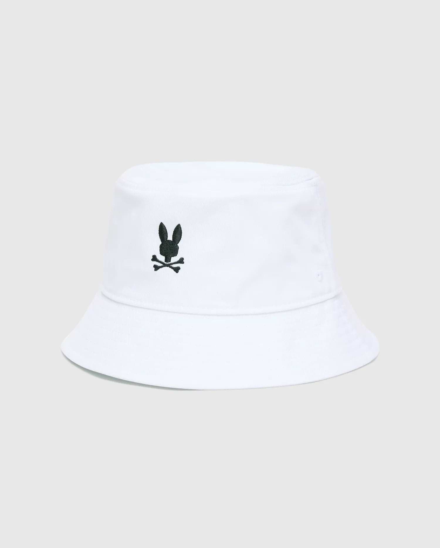 Mens Jimmy Bucket Hat in crisp white cotton twill, featuring a prominent black embroidered Psycho Bunny skull logo centered on the front, with subtle ventilation eyelets.