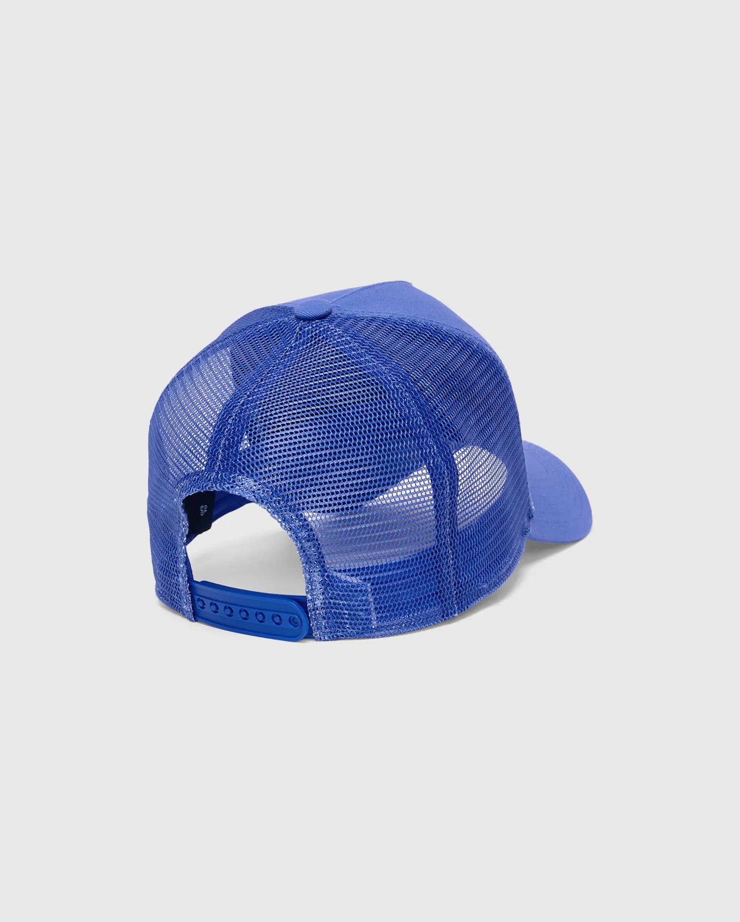 Mens Tobias Trucker Cap in royal blue, featuring a breathable mesh back, adjustable snapback closure, and a small embroidered Psycho Bunny skull logo on the left side.
