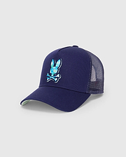 Mens Ethan Trucker Cap in navy blue, featuring a large, embroidered Psycho Bunny skull logo with a blue and teal patterned fill on the front, mesh back, and a light green underbrim.