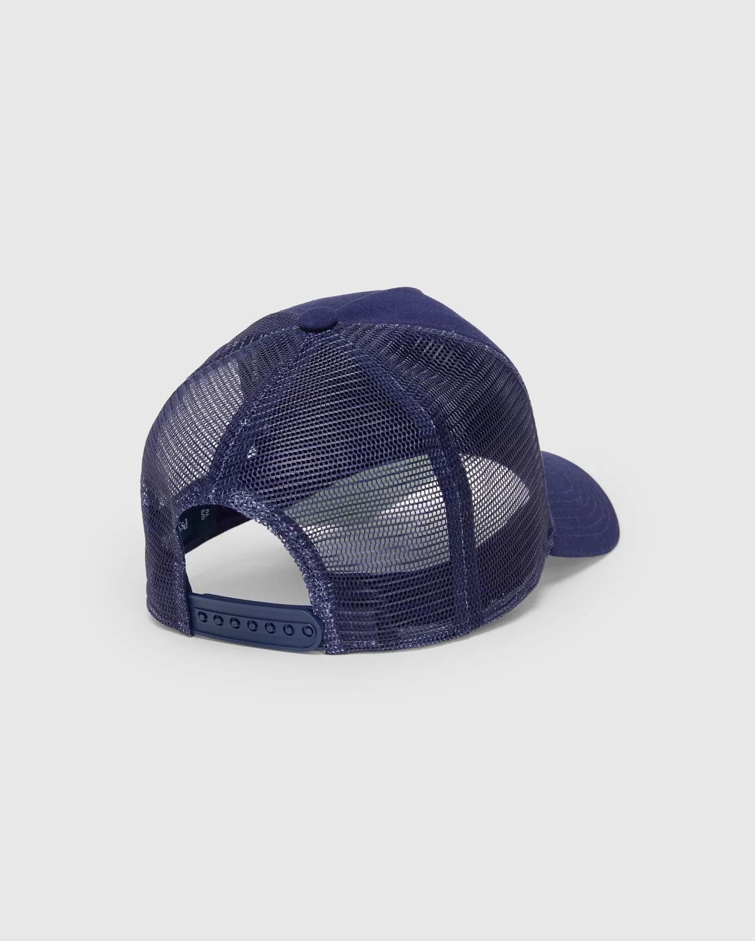 Mens Ethan Trucker Cap in navy blue, featuring breathable mesh back panels, a solid fabric crown and brim, and an adjustable snapback closure with subtle Psycho Bunny branding.