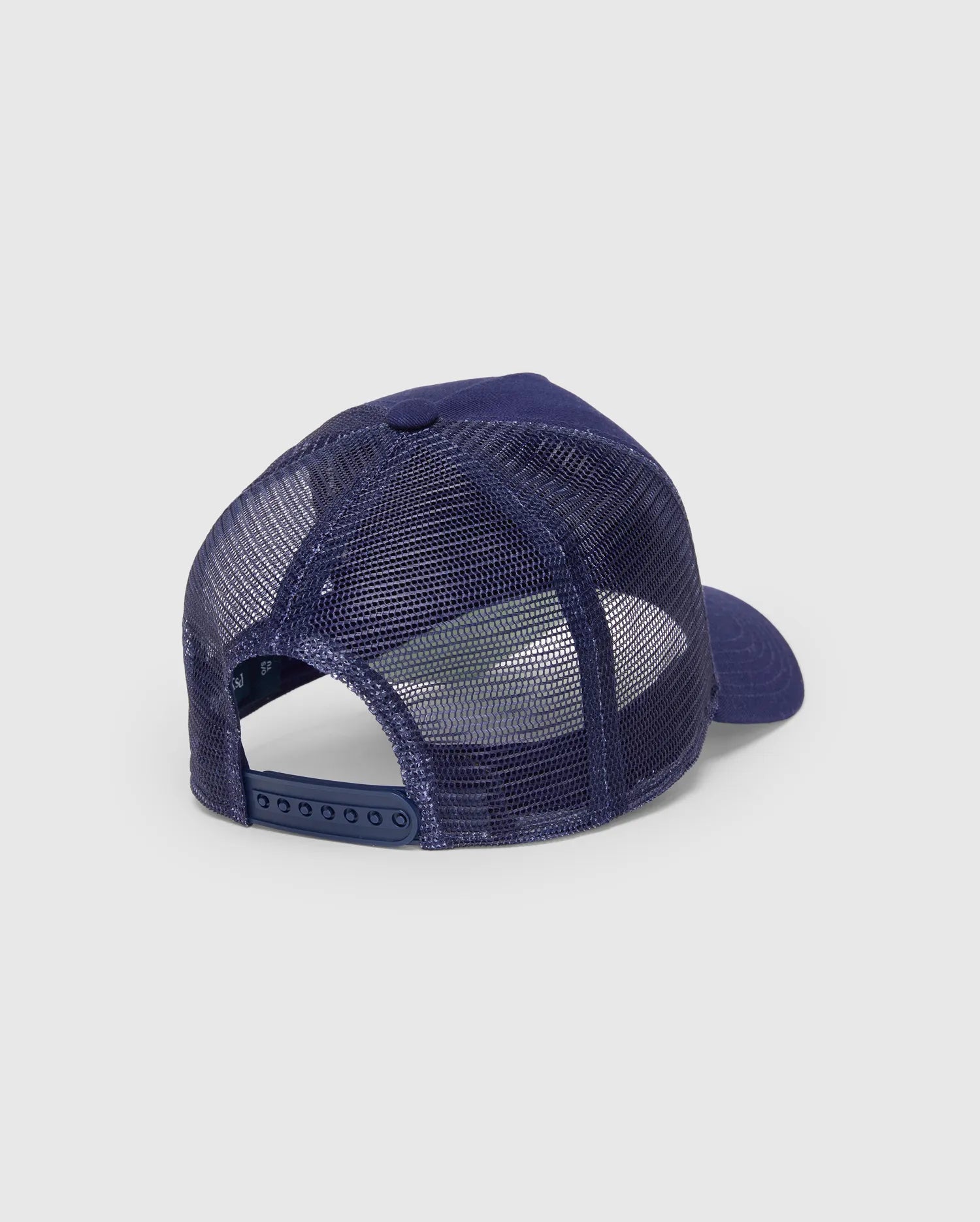 Mens Ethan Trucker Cap in navy blue, featuring breathable mesh back panels, a solid fabric crown and brim, and an adjustable snapback closure with subtle Psycho Bunny branding.