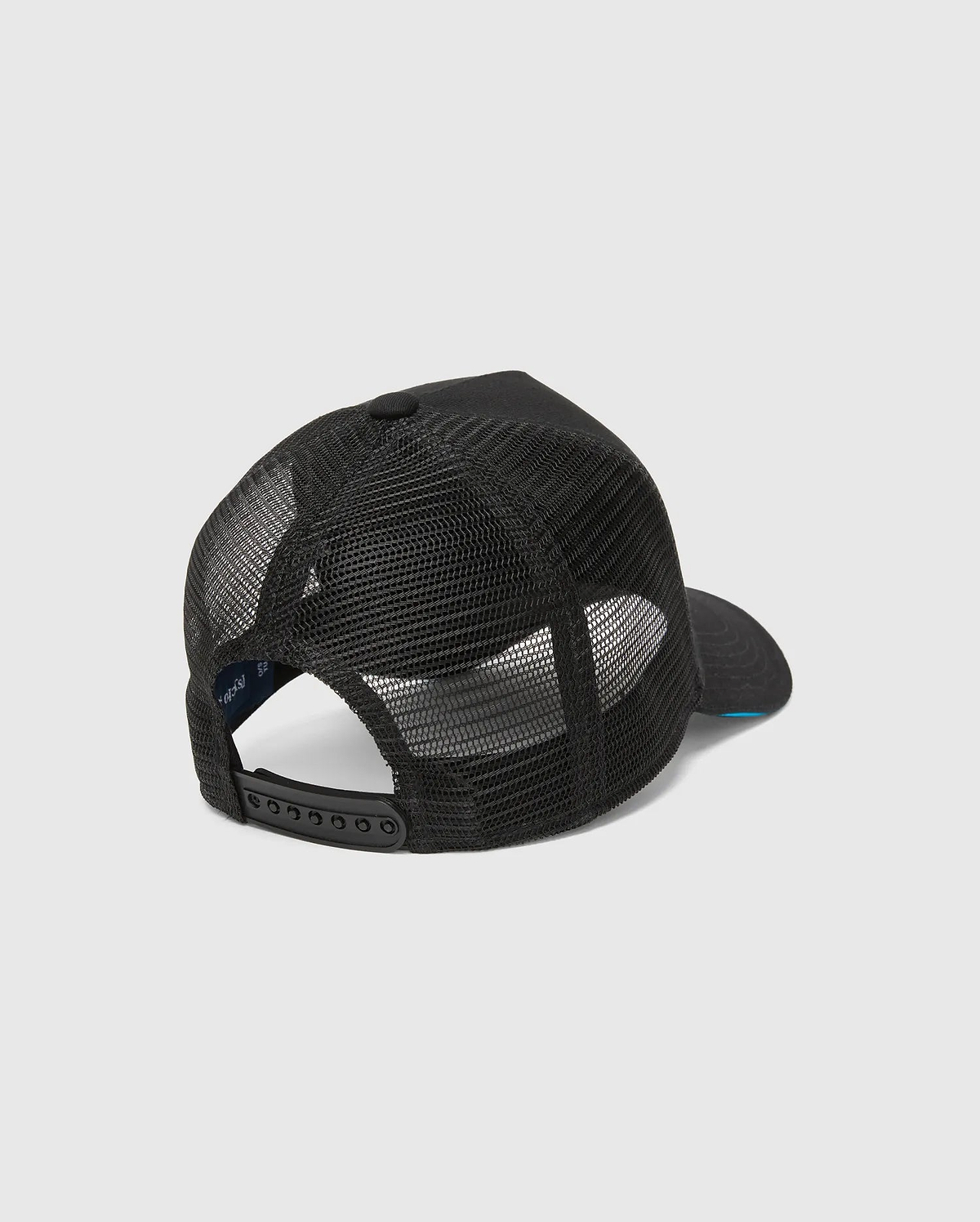 Mens Apollo Trucker Cap in black, featuring breathable mesh back panels, an adjustable snapback closure, and a subtle blue underside brim. Psycho Bunny branding is visible on the inner band.