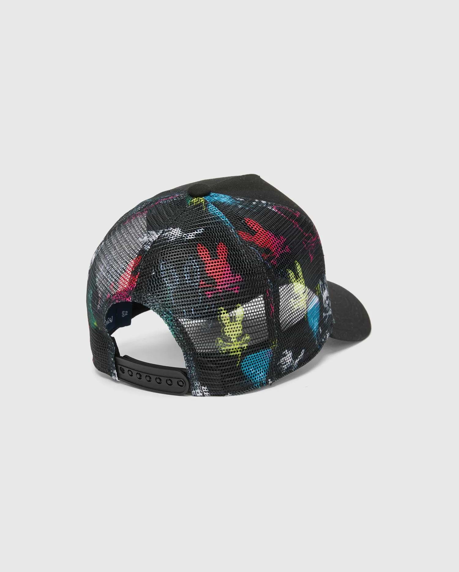 Mens Quintin Trucker Cap in black, featuring a vibrant multi-color Psycho Bunny skull print on the front panels and a breathable black mesh back with an adjustable snapback closure.