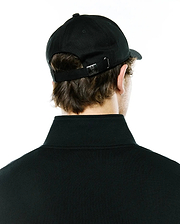 Black Mens Ambrose Baseball Cap featuring an adjustable strap with a silver metal buckle engraved with the iconic Psycho Bunny skull logo, paired with a black classic fit pique polo shirt with a ribbed collar.