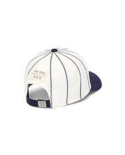 Mens Nathaniel Soft Baseball Cap, off-white cotton twill with navy brim, black stitched pinstripes, rear New York Psycho Bunny patch, and silver bunny skull buckle.