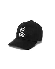 Mens Kenneth A-Frame Trucker Cap in black, featuring a prominent white embroidered Psycho Bunny skull logo on the front, crafted from smooth, durable fabric.