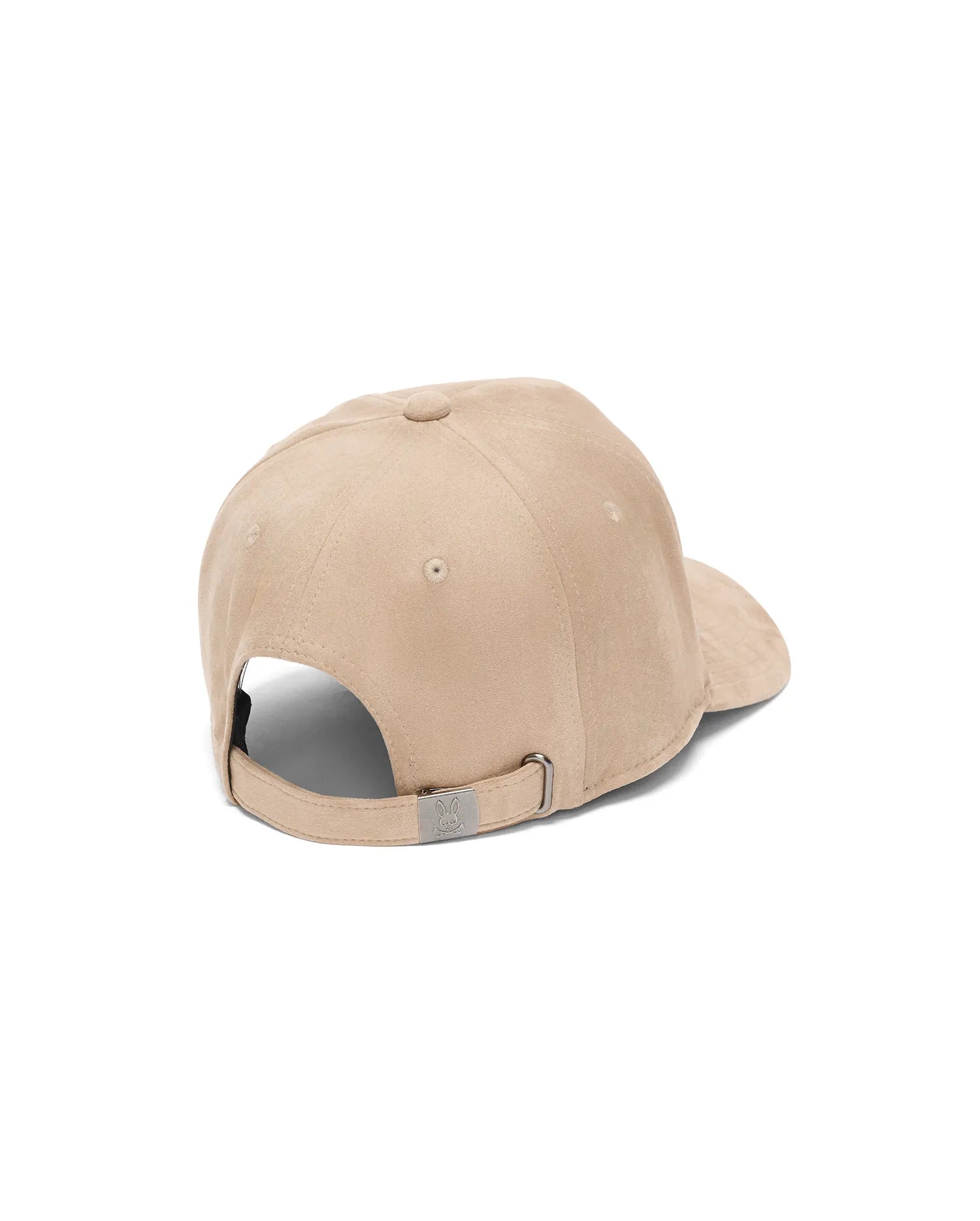 Mens Kenneth A-Frame Trucker Cap in beige suede-like fabric, featuring an adjustable strap with a small, engraved Psycho Bunny skull logo on the silver metal buckle at the back.