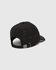 Mens Blaze Sport Cap, black perforated performance fabric with white brim trim, adjustable strap, and a small silver Psycho Bunny skull logo embossed on the metal buckle.