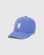 Mens Blaze Sport Cap in periwinkle, featuring a prominent white embroidered Psycho Bunny skull logo on the front, perforated side panels, and a white trim accent on the brim. (2)
