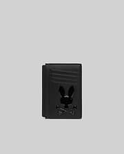 Black textured leather Bunny Card Case featuring multiple card slots and a prominent, glossy black Psycho Bunny skull logo centered on the front.