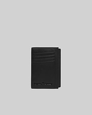 Black Bunny Card Case crafted from smooth, premium material, featuring multiple card slots and an embossed Psycho Bunny skull logo with text on the front.