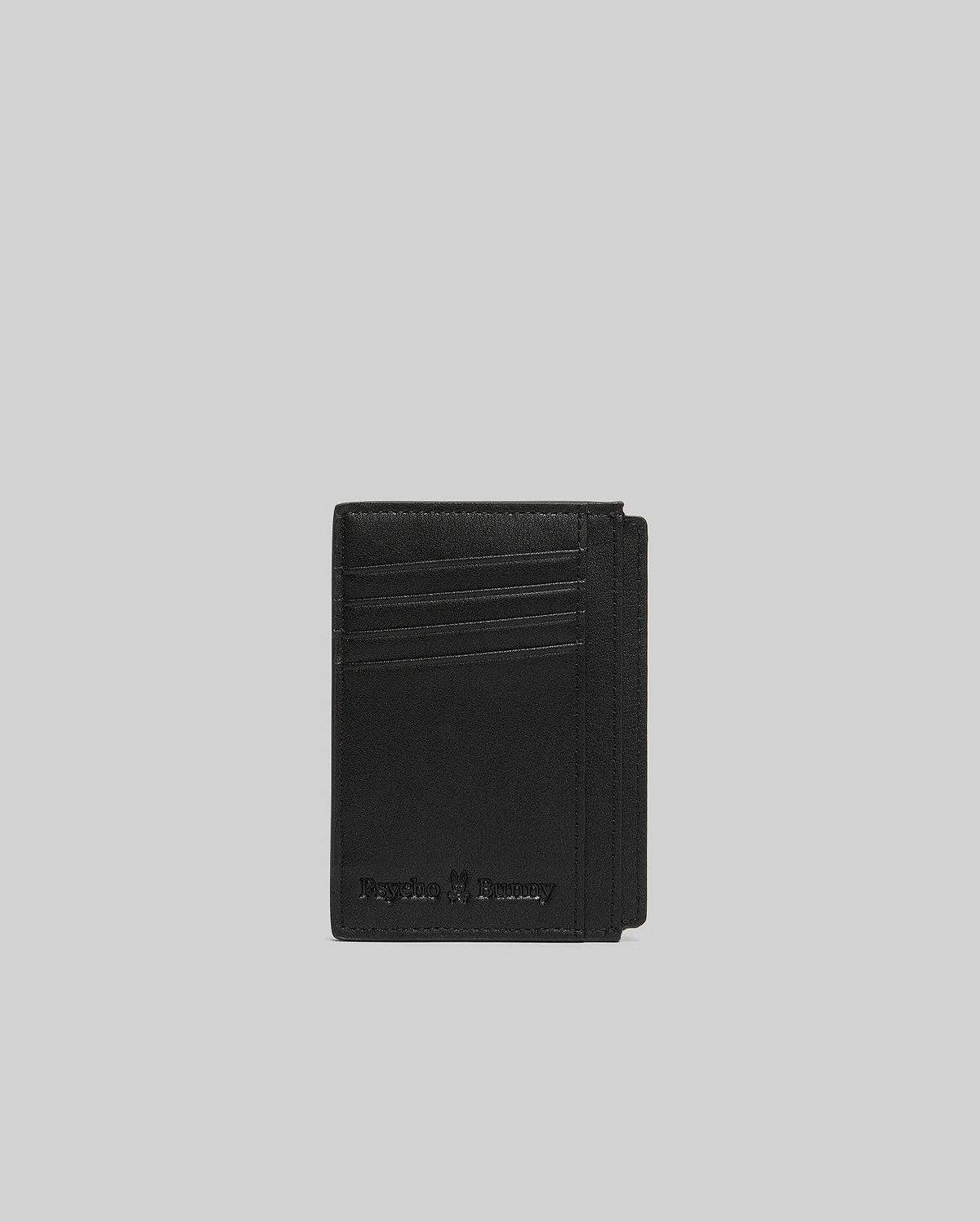 Black Bunny Card Case crafted from smooth, premium material, featuring multiple card slots and an embossed Psycho Bunny skull logo with text on the front.
