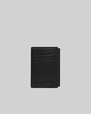 Black Bunny Card Case crafted from smooth, premium material, featuring multiple card slots and an embossed Psycho Bunny skull logo with text on the front.