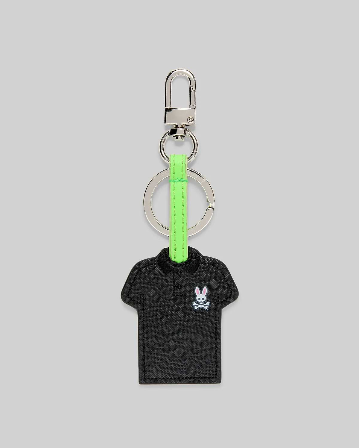 Iconic Polo Keychain featuring a black textured faux leather polo shirt shape with a small embroidered pink and white Psycho Bunny skull logo, attached to a silver metal clasp and key ring with a vibrant neon green strap.