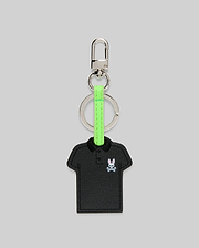 Iconic Polo Keychain featuring a black textured faux leather polo shirt shape with a small embroidered pink and white Psycho Bunny skull logo, attached to a silver metal clasp and key ring with a vibrant neon green strap.