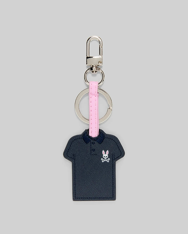 Iconic Polo Keychain featuring a navy blue textured faux leather polo shape with a small pink and white Psycho Bunny skull logo on the left chest, attached to a pink strap and silver metal hardware.