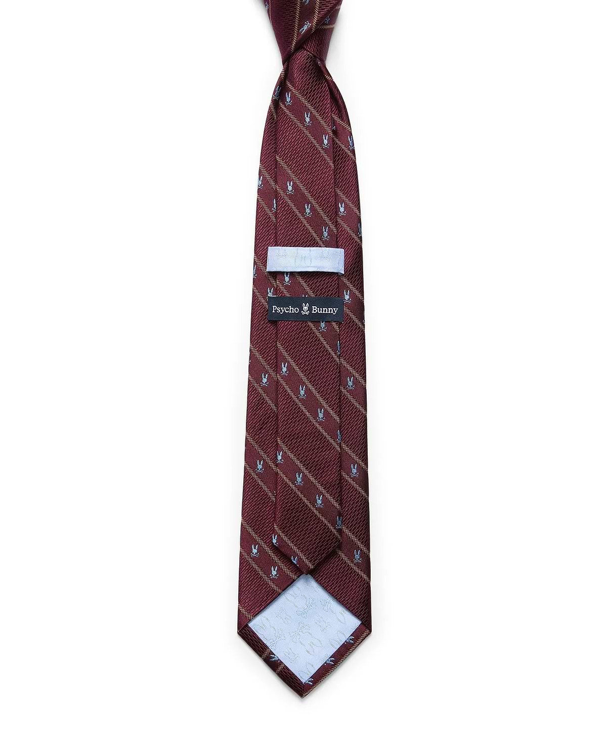 Mens Bunny Stripe Woven Tie in burgundy with diagonal gold stripes and a repeating light blue Psycho Bunny skull pattern. Woven texture, with a Psycho Bunny brand tag on the back.